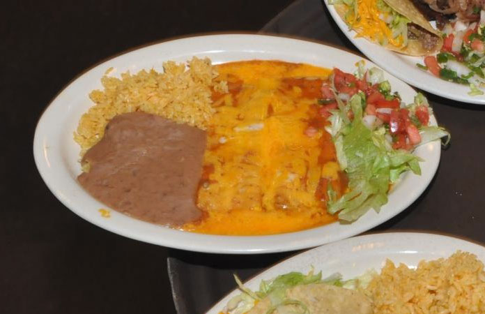Enchiladas, rice, and beans