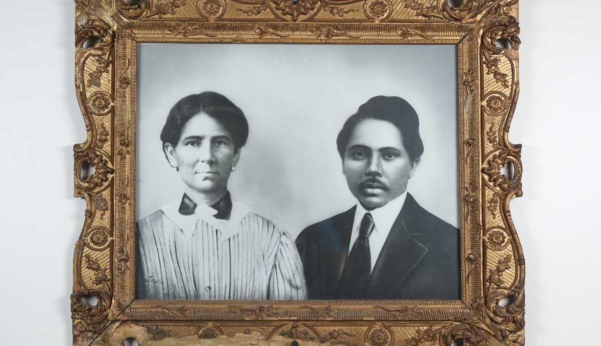 a black and white portrait of a woman and a man inside of an ornate gold frame