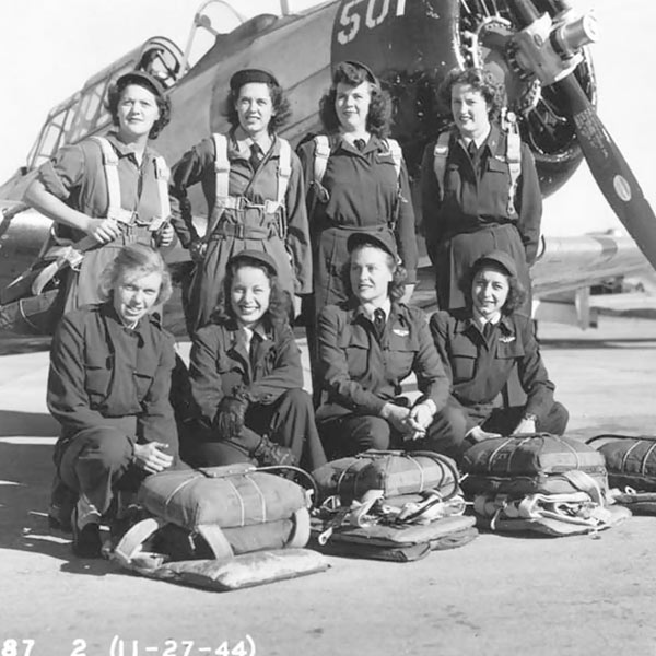 Eight WASP pilots in front of a North American AT-6 Texan, November 27, 1944, at Waco Army Airfield, Texas. After the order to disband, classes in progress were allowed to continue until graduation. On December 20, 1944, the WASP program shut down for good. Courtesy National Archives, Washington, DC 