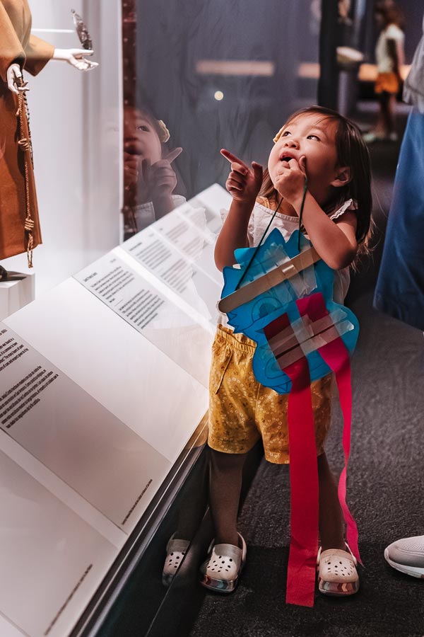 a child exploring an exhibition at the Bullock Museum