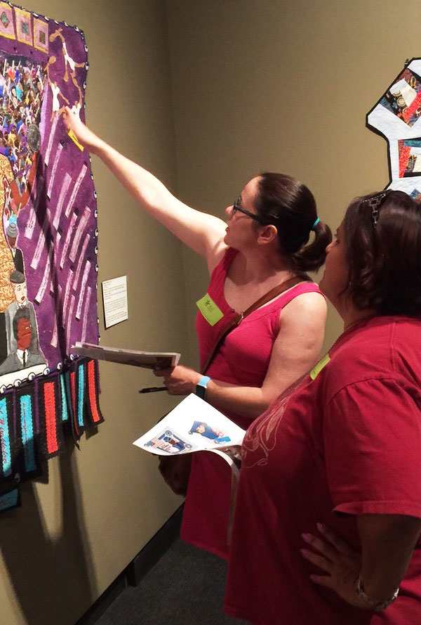 Teachers discuss story quilt exhibition