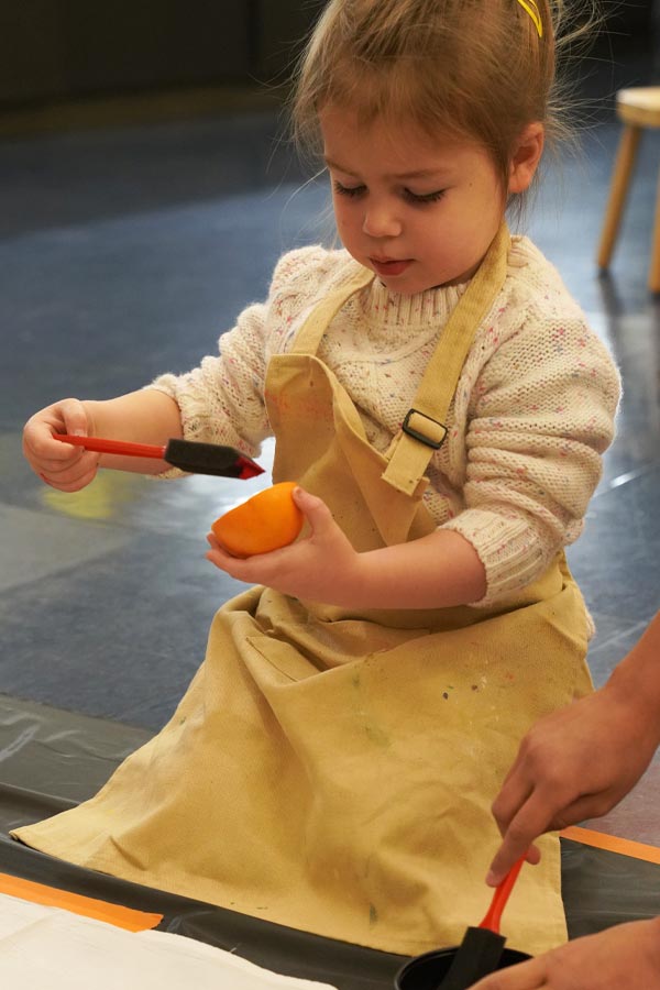 a child doing a craft at the Bullock Museum