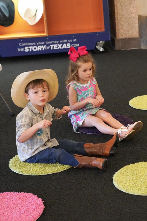 a young child wearing a cowboy hat at the Bullock Museum