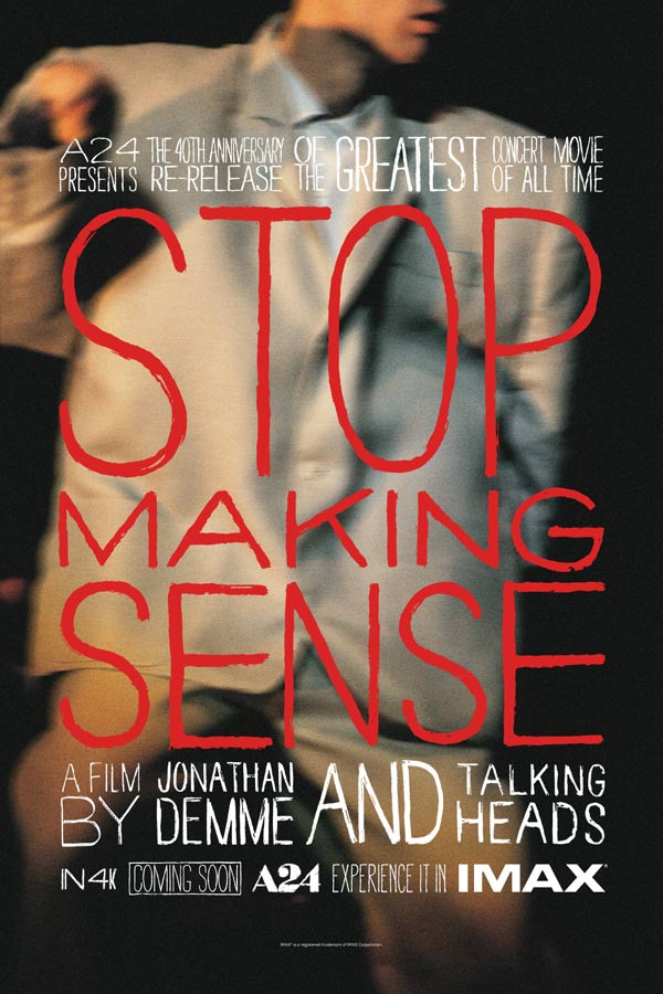 film poster for "Stop Making Sense" of a blurry image of a man in a large grey suit, red lettering on top reads "Stop Making Sense"