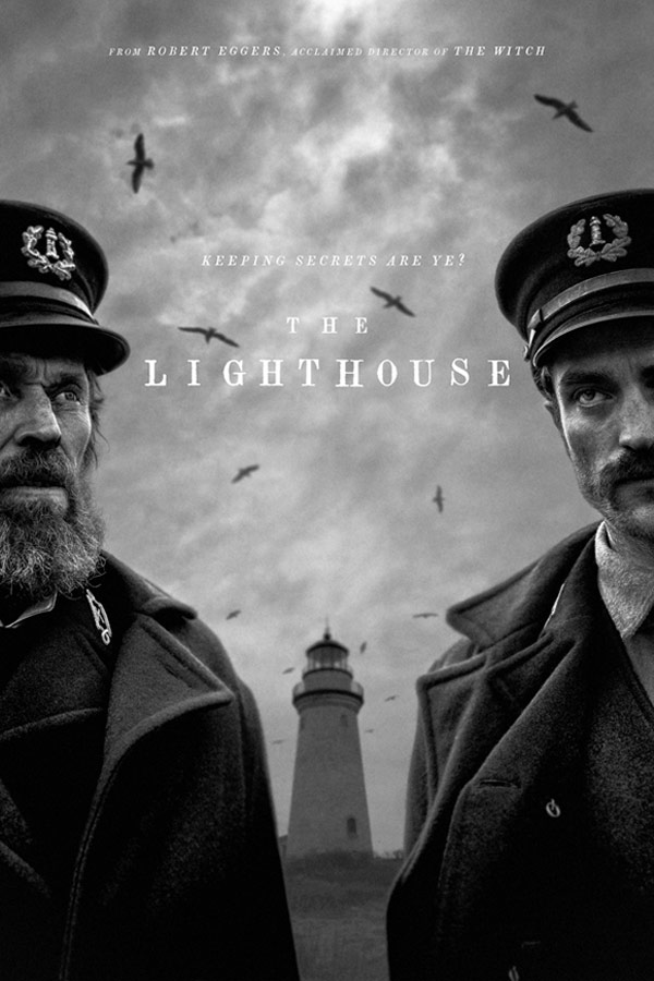 film poster for "The Lighthouse" with two men standing with a lighthouse between them