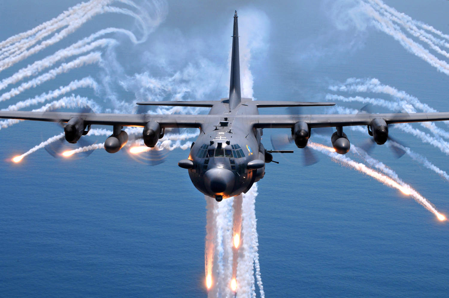 bomber airplane shooting bombs with con trails