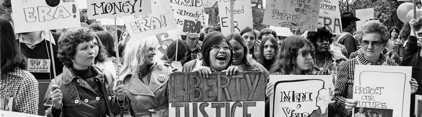 group of women with protest signs in favor of the Equal Rights Amendment