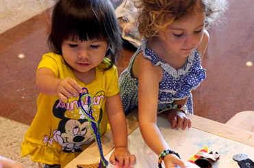 two children doing a craft at the Bullock Museum