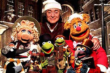 film poster for "The Muppet Christmas Carol" with various Muppet characters posing with Michael Caine