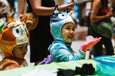 two children dressed as characters from the Australian TV show Bluey