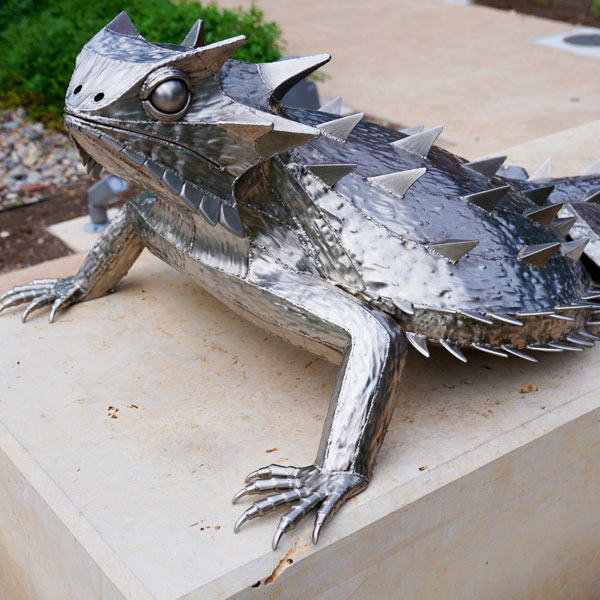 A sculpture of a horned lizard by Houston artist Dylan Conner can be seen right across from the Bullock Museum on the Texas Capitol Mall.