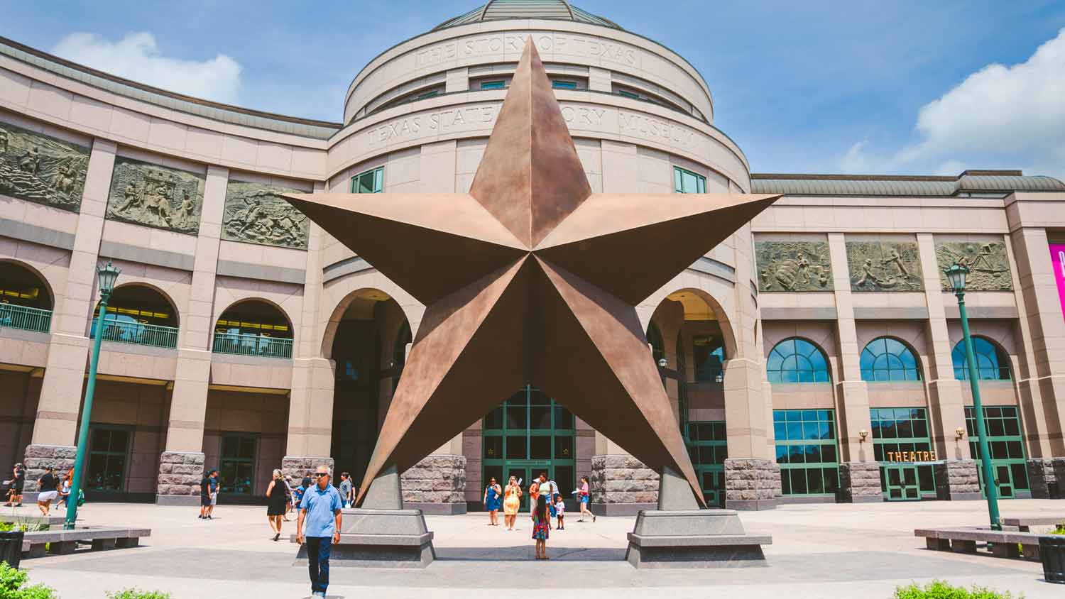 People standing outside of the Bullock Museum in Austin